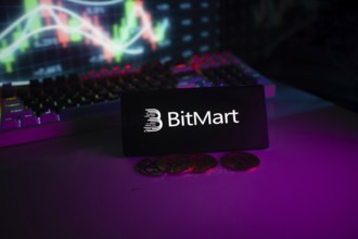 BitMart logo in a neon-lit setting with coins and trading charts in the background