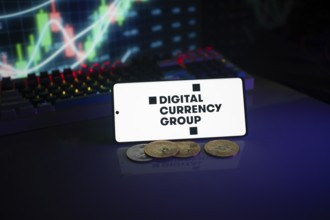 Digital Currency Group screen with coins in front of a vibrant stock chart setting