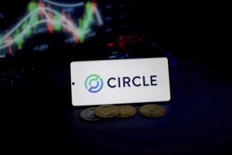 Circle logo highlighted with coins and fluctuating market charts, emphasizing digital trade