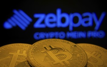 Dhaka, Bangladesh- 03 Sep 2025: Close-up of Bitcoin coins with the zebpay logo visible on a screen