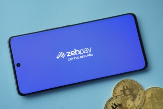 Dhaka, Bangladesh- 03 Sep 2025: zebpay logo on smartphone screen near Bitcoin coin and QR code on