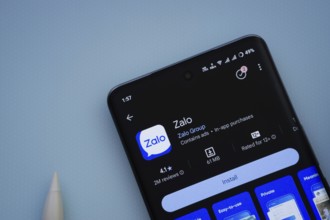 Dhaka, Bangladesh- 29 May 2025: On a blue surface, a smartphone displays the Zalo app within the