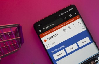 Dhaka, Bangladesh- 23 June 2025: A smartphone displaying the Zalando website with a shopping cart