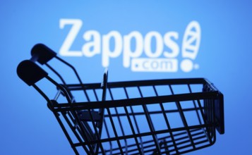 Dhaka, Bangladesh- 03 July 2025: Silhouette of a shopping cart in front of the Zappos logo,