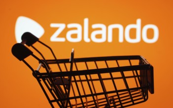 Dhaka, Bangladesh- 03 July 2025: Silhouette of a shopping cart in front of the Zalando logo,
