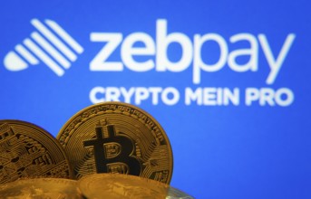 Dhaka, Bangladesh- 15 June 2025: Close-up of Bitcoin coins with the zebpay logo visible on a screen