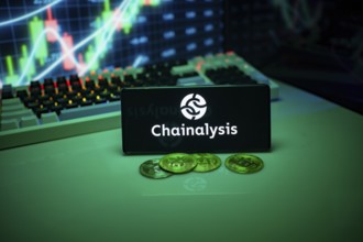 Chainalysis shown on a smartphone with currency and financial data displayed