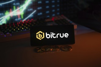 Bitrue logo in a dark setting with a glowing chart and coins, illuminated in orange