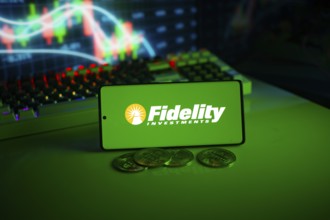 Fidelity Investments logo on green screen with coins and trading graphs in background