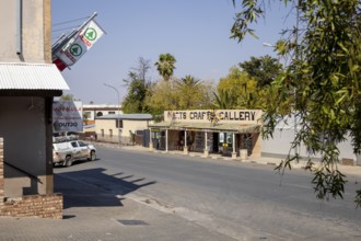 Street view of a modern building with a restaurant or café entrance in Outjo, Namibia 12 Augusto