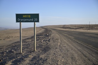 Distance sign near Oranjemund, diamond restricted area, Karas region, Namibia