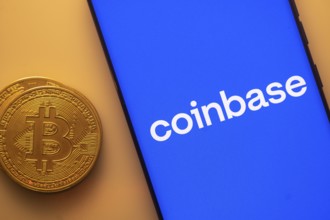 Coinbase screen with Bitcoin coin, representing cryptocurrency exchange platform