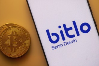 Bitlo displayed on white screen with Bitcoin coin, indicating crypto trading service