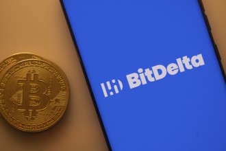 Blue BitDelta screen and Bitcoin coin, associated with crypto transactions