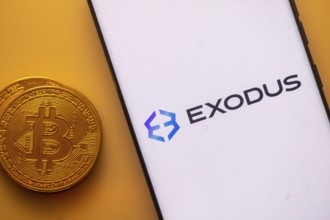Exodus logo on white screen alongside Bitcoin coin, related to crypto wallet