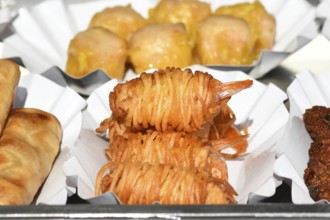Fried Thai street food potato noodle prawns on small trays