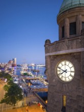 Evening atmosphere at the Landungsbrücken with a view of the Elbphilharmonie and the historic