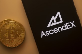 Bitcoin coin beside AscendEX logo on a black background, reflecting crypto trading