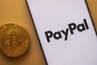 Bitcoin coin beside PayPal logo on a white background, symbolizing digital transactions