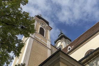 Baroque church towers with clocks against a blue sky, Gothic architectural details, St Stephan's