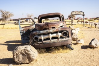 Solitaire's car graveyard in Namibia 27 August, 2025: features rusted vintage cars near small