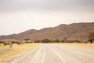 Dirt Road in Solitaire, Namibia, located on the edge of the Namib Desert, surrounded by dunes and