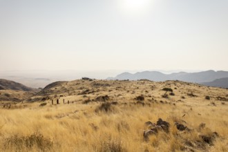 A picnic spot overlooks the vast Namib Desert from Spreetshoogte Pass, with hazy plains, rugged