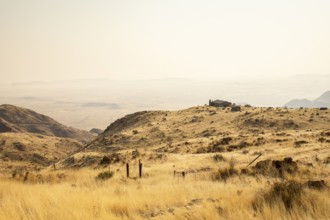 A picnic spot overlooks the vast Namib Desert from Spreetshoogte Pass, with hazy plains, rugged