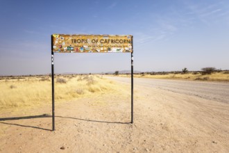 Namibia- 25 August, 2025: Road sign marking the Tropic of Capricorn in Namibia's dry, sandy