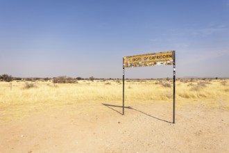 Namibia- 25 August, 2025: Road sign marking the Tropic of Capricorn in Namibia's dry, sandy