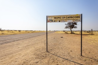 Namibia- 25 August, 2025: Road sign marking the Tropic of Capricorn in Namibia's dry, sandy