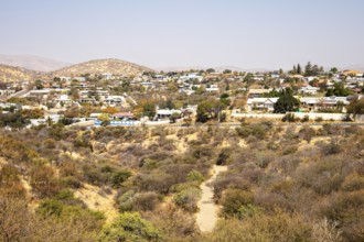 A panoramic view of Windhoek, Namibia, from the National Botanic Garden, showing the city's mix of