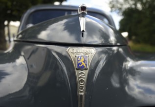 Front view of a vintage Peugeot 203, seen at a company anniversary of Energie-Mann in Westerwald
