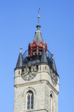 Close-up of 14th century Gothic belfry tower with carillon and clock in the historic city centre of