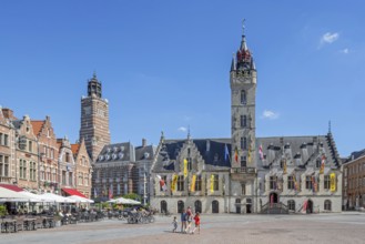 City hall with belfry, restaurants and pavement cafes on Market Square in historic town centre of
