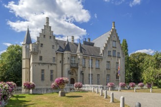 Kasteel Cortewalle, 15th century moated castle in Flemish Renaissance style at Beveren in summer,