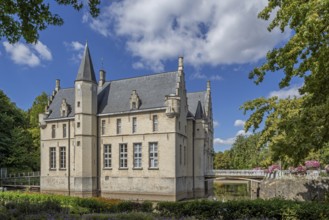 Kasteel Cortewalle, 15th century moated castle in Flemish Renaissance style at Beveren in summer,