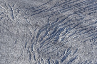 This view shows the ice surface with many crevasses. Distinct details reveal the effects of time