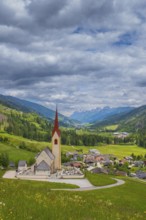 View of the church of Winnebach with the valley behind it, San Candido, Val Pusteria, Dolomites,