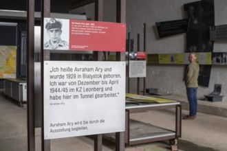 Visitor stands in the documentation centre in the old Engelberg tunnel, first motorway tunnel in