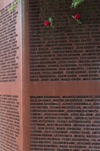 Pinned roses, name wall made of steel plates with a total of 2908 laser-engraved names of former