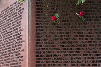 Pinned roses, name wall made of steel plates with a total of 2908 laser-engraved names of former