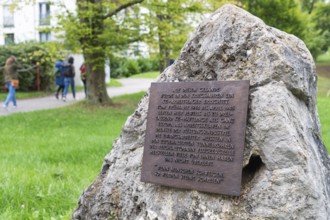 Stone with memorial plaque commemorating forced labourers and prisoners in concentration camp