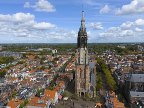 Central view of the historic city centre with high church tower and many red roofs, aerial view,