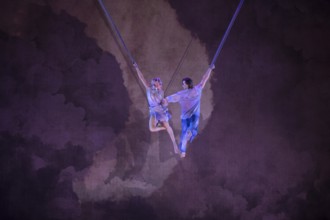 Two artists float at the press screening of Alizé, a joint production by Cirque du Soleil and Live