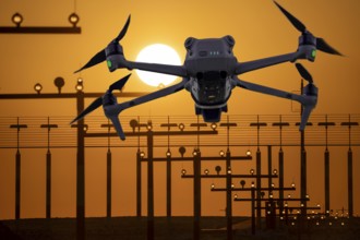 Symbolic image, photomontage, reconnaissance, spying with drones here at an airport, critical