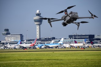Symbolic image, photomontage, reconnaissance, spying with drones here at an airport, critical