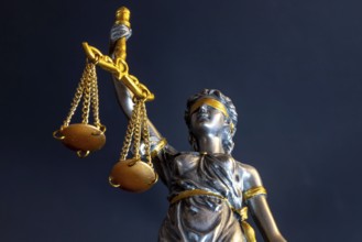 Close-up of a Justitia as a symbol of court judgements, jurisdiction, justice, etc