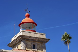 Ponta da Piedade lighthouse on the Ponta da Piedade rocky coast, rugged coastal landscape, right