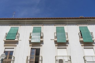 Facade of buildings in Tavira, old town, in the east of the Algarve, Portugal